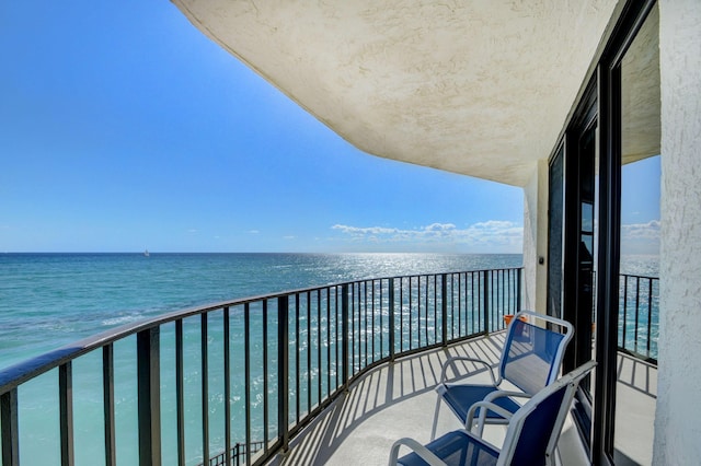 balcony featuring a water view