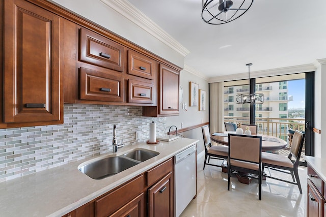 kitchen with sink, crown molding, white dishwasher, tasteful backsplash, and decorative light fixtures