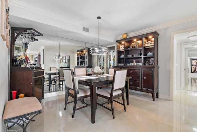 dining area featuring ornamental molding