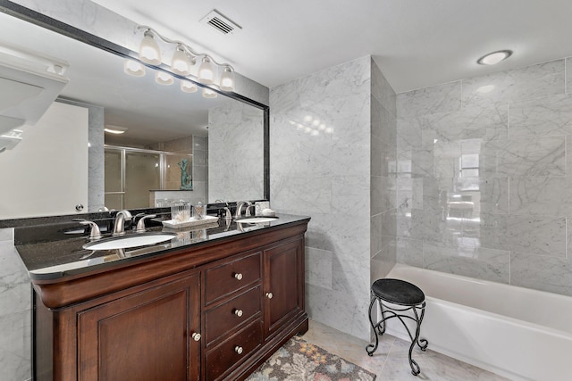 bathroom with tile walls and vanity