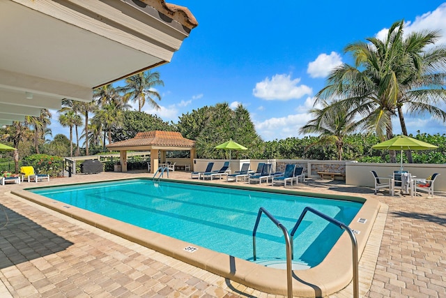 view of pool featuring a gazebo and a patio