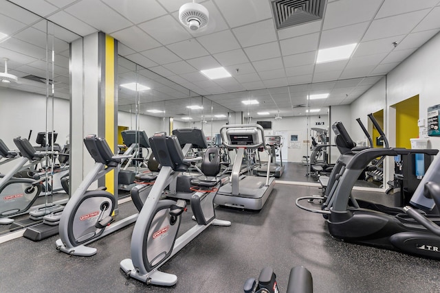 workout area with a paneled ceiling