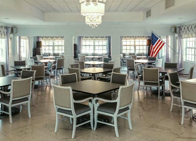 2871 N Ocean Blvd Unit F427, Boca Raton, FL 33431 - dining room with carpet floors and ornamental molding