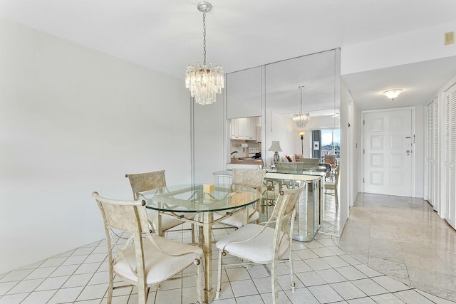 2871 N Ocean Blvd Unit F427, Boca Raton, FL 33431 - dining space with a chandelier and light tile patterned floors