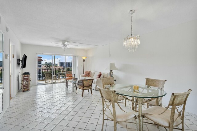 2871 N Ocean Blvd Unit F427, Boca Raton, FL 33431 - dining space with a ceiling fan and a chandelier