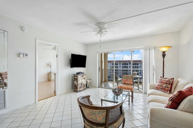 2871 N Ocean Blvd Unit F427, Boca Raton, FL 33431 - living area featuring ceiling fan and light tile patterned flooring
