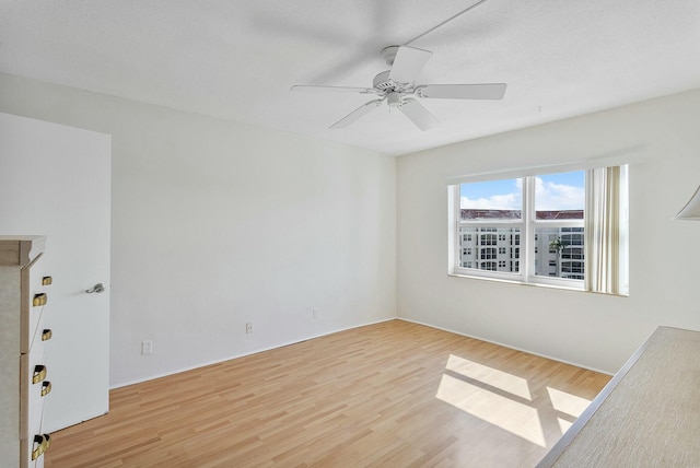 2871 N Ocean Blvd Unit F427, Boca Raton, FL 33431 - spare room featuring wood finished floors and a ceiling fan