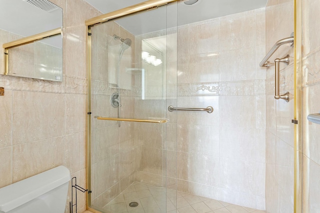 2871 N Ocean Blvd Unit F427, Boca Raton, FL 33431 - full bathroom featuring a shower stall and toilet