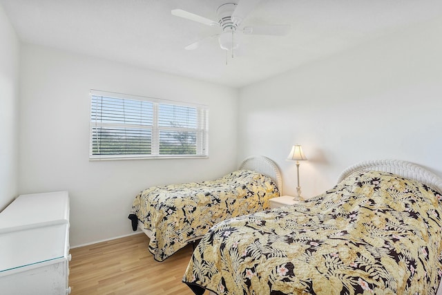 2871 N Ocean Blvd Unit F427, Boca Raton, FL 33431 - bedroom with wood finished floors, a ceiling fan, and baseboards