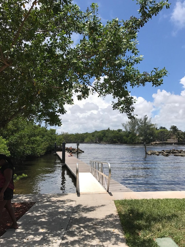 2871 N Ocean Blvd Unit F427, Boca Raton, FL 33431 - dock featuring a water view and a boat ramp