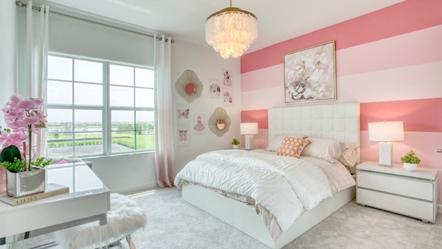 carpeted bedroom with a notable chandelier