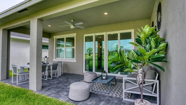 view of patio featuring ceiling fan