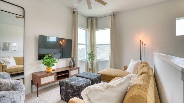 living room with light colored carpet and ceiling fan