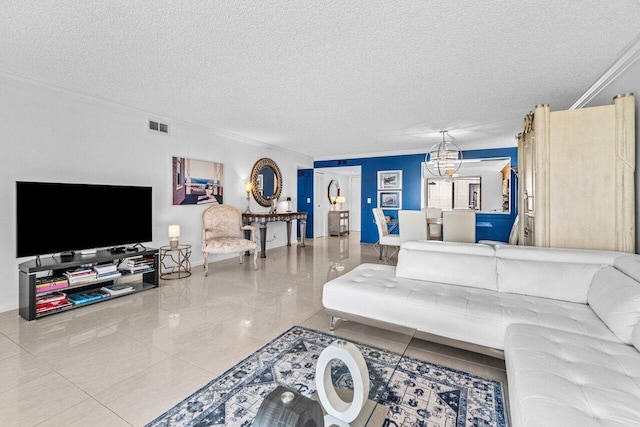 living room with ornamental molding, a chandelier, and a textured ceiling