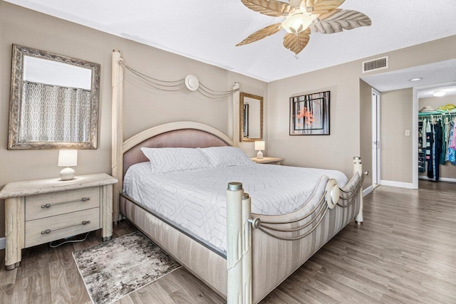 bedroom featuring ceiling fan and light hardwood / wood-style floors