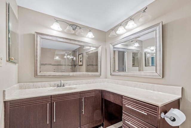 bathroom featuring vanity and a tile shower