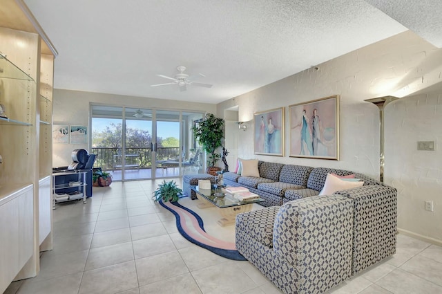 tiled living room with ceiling fan and a textured ceiling