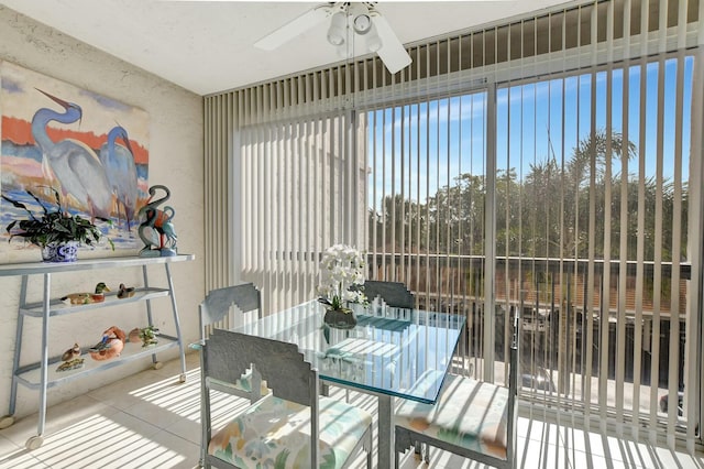 sunroom / solarium featuring ceiling fan