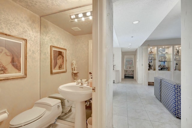 bathroom with tile patterned floors and toilet