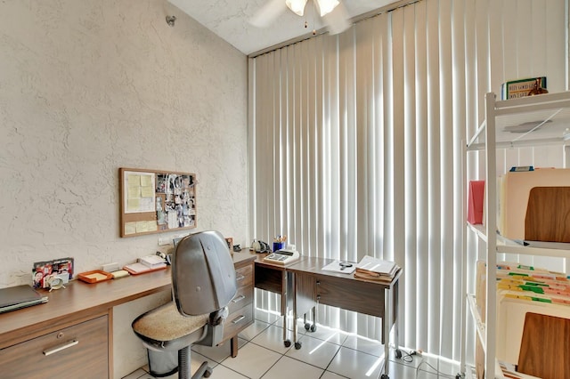 office with light tile patterned floors and ceiling fan