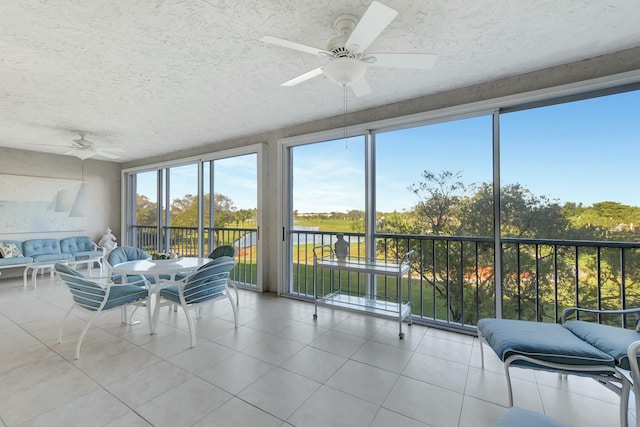 sunroom / solarium with ceiling fan and plenty of natural light