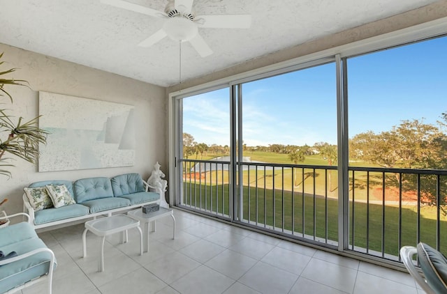 sunroom featuring ceiling fan