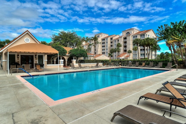 view of pool featuring a patio