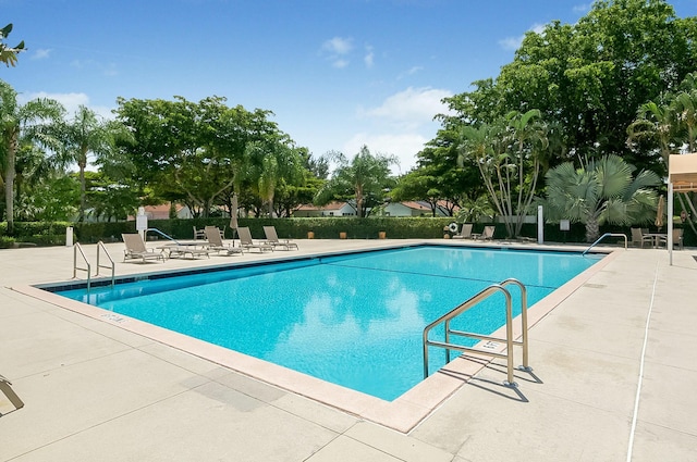 view of swimming pool featuring a patio area