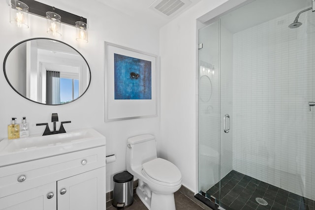 bathroom with walk in shower, vanity, and toilet