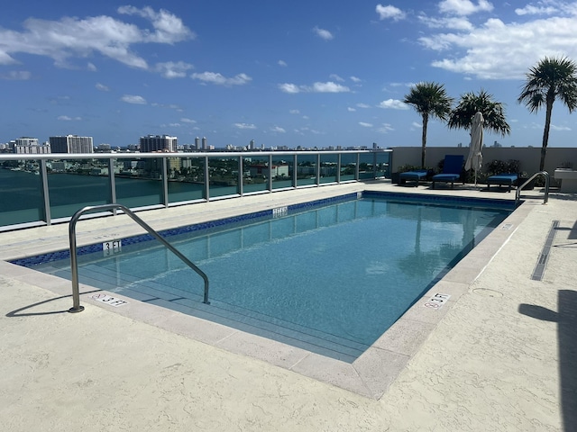 view of swimming pool featuring a patio