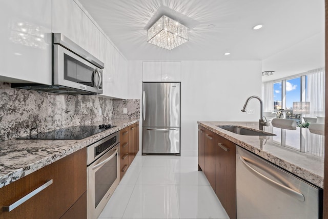 bathroom featuring tile patterned flooring, vanity, and walk in shower