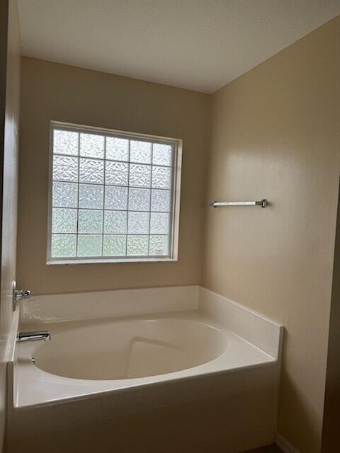 bathroom featuring a tub