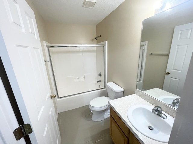 full bathroom with vanity, enclosed tub / shower combo, and toilet