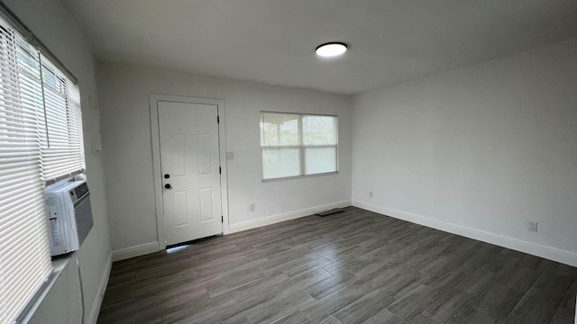 entryway featuring cooling unit, plenty of natural light, and dark hardwood / wood-style floors