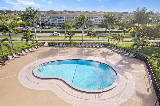 view of swimming pool with a patio