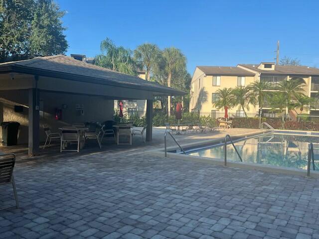 view of swimming pool featuring a gazebo and a patio area