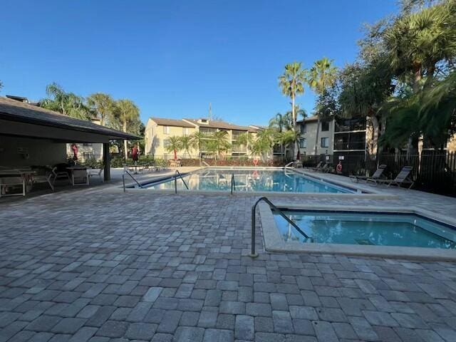 view of swimming pool featuring a patio area