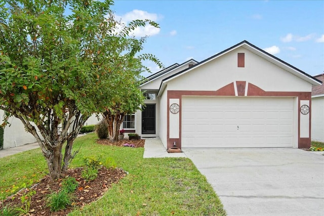 view of front of property featuring a garage and a front yard