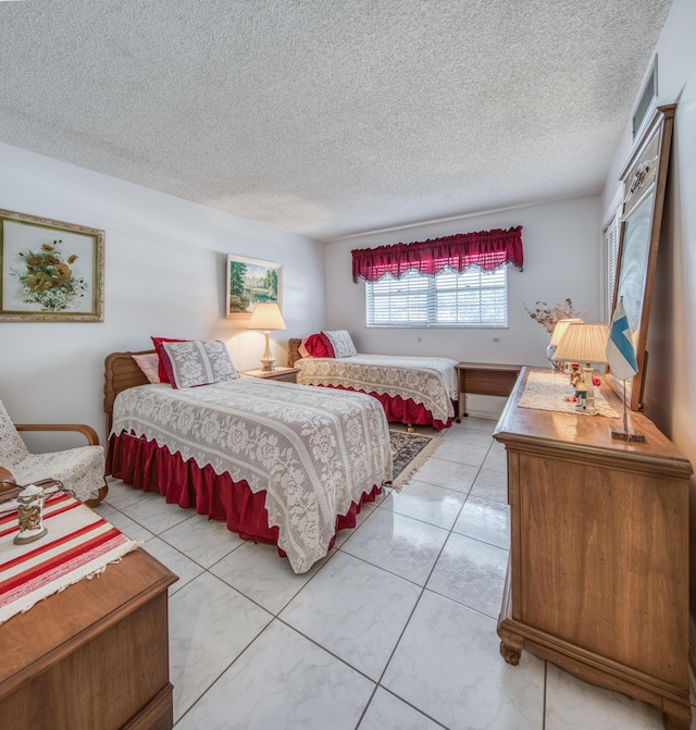 tiled bedroom with a textured ceiling