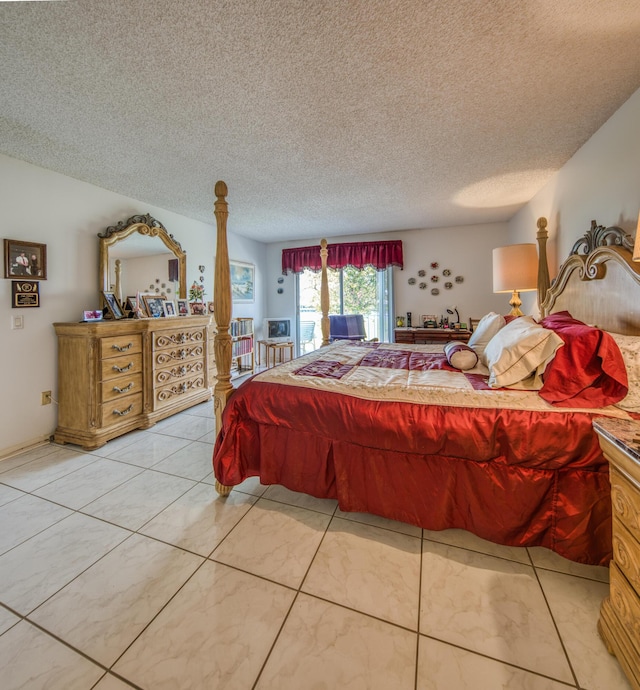 bedroom with access to outside and a textured ceiling