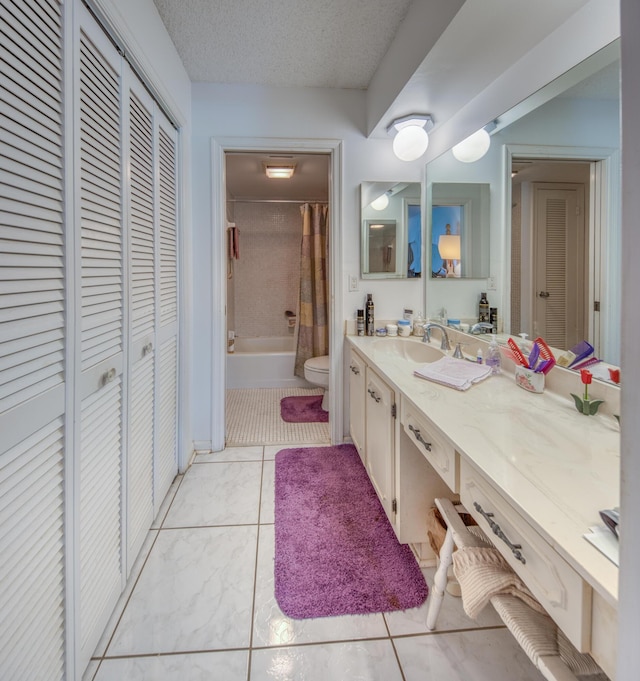 full bathroom with tile patterned flooring, shower / tub combo, vanity, a textured ceiling, and toilet