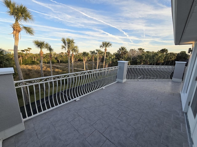 view of patio featuring a balcony