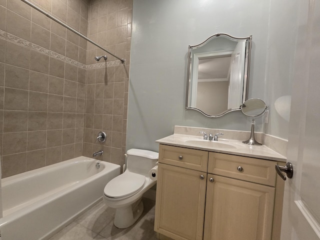 full bathroom featuring vanity, tile patterned flooring, tiled shower / bath combo, and toilet