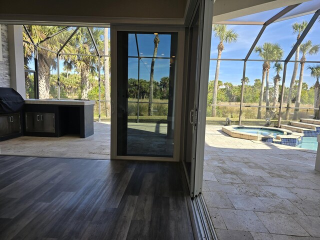 doorway featuring hardwood / wood-style floors and a wealth of natural light