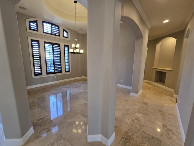 interior space featuring a notable chandelier and crown molding