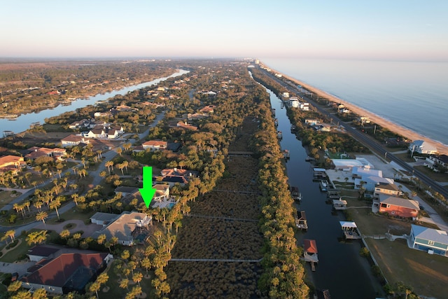 aerial view at dusk with a water view