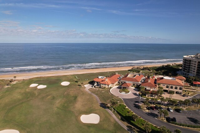 bird's eye view with a view of the beach and a water view