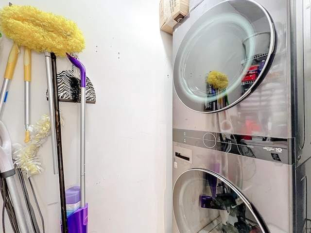 washroom with stacked washer / drying machine