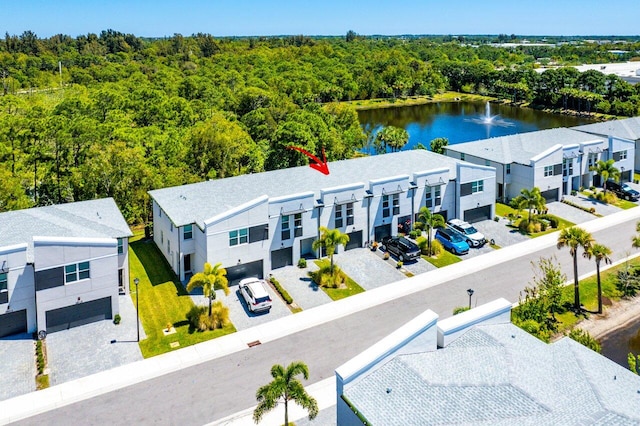 birds eye view of property with a water view