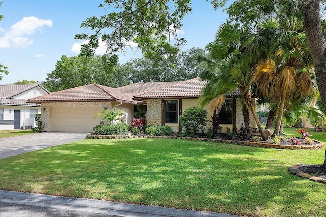 view of front of house featuring an attached garage, a tile roof, decorative driveway, stucco siding, and a front lawn